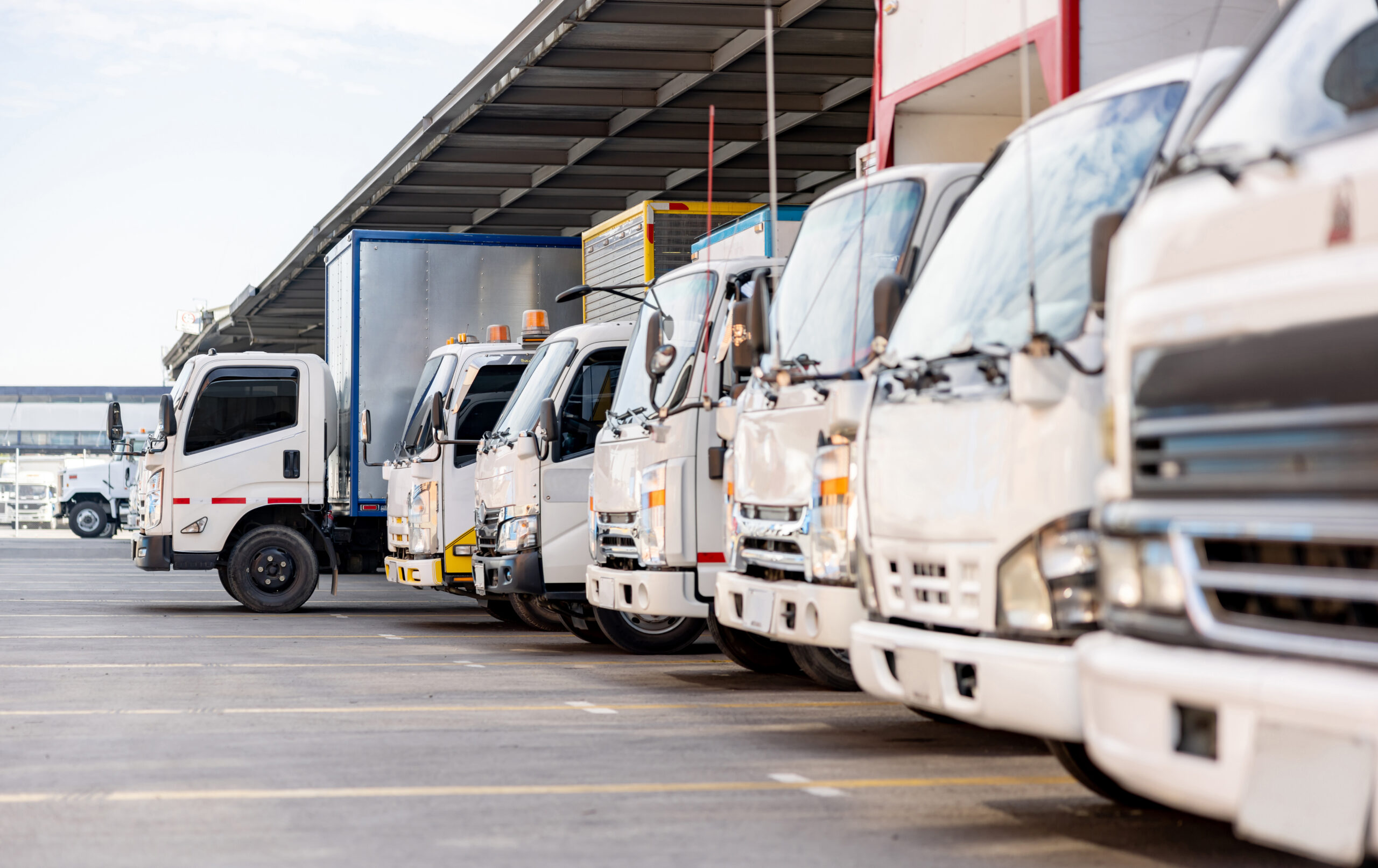 Trucks parked in a distribution warehouse ready to deliver some cargo